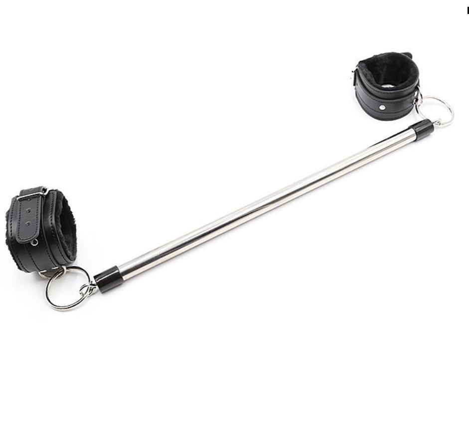 30cm Spreader Bar with Wrist and Ankle Restraints, a versatile and durable BDSM accessory that will elevate your play. This spreader bar is designed to keep your submissive in a spread-eagle position, allowing for increased access and vulnerability. The bar is made of sturdy metal and is adjustable to accommodate different body types and sizes.